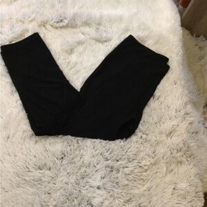 N.Y.L. Woman’s Large black legging with fishnet detail from thigh to knee